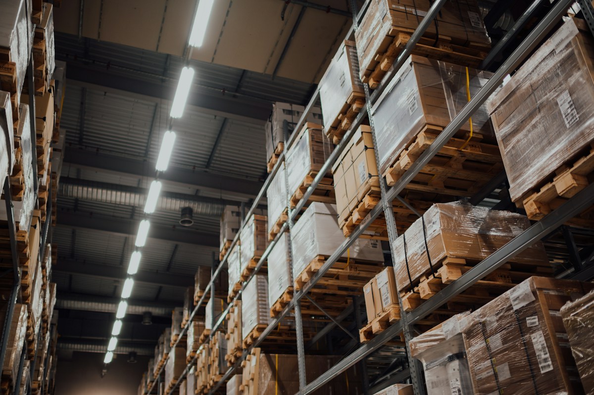 Warehouse aisle with palletized goods on storage racks